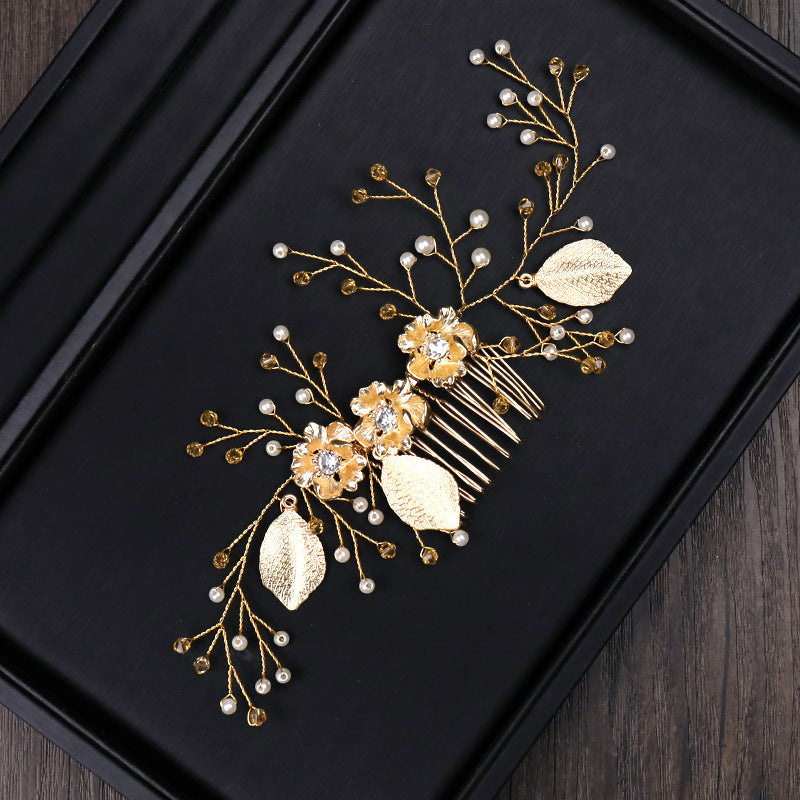 Luxurious golden hair accessory with leaves and flowers for party or wedding