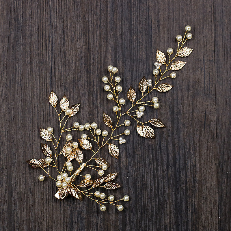Luxurious golden hair accessory with leaves and flowers for party or wedding