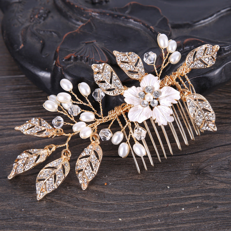 Luxurious golden hair accessory with leaves and flowers for party or wedding